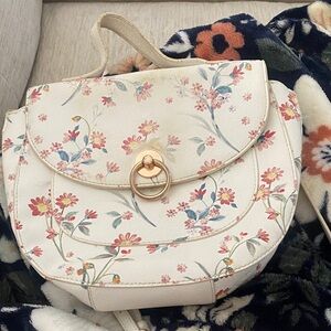 White floral purse with gold accents